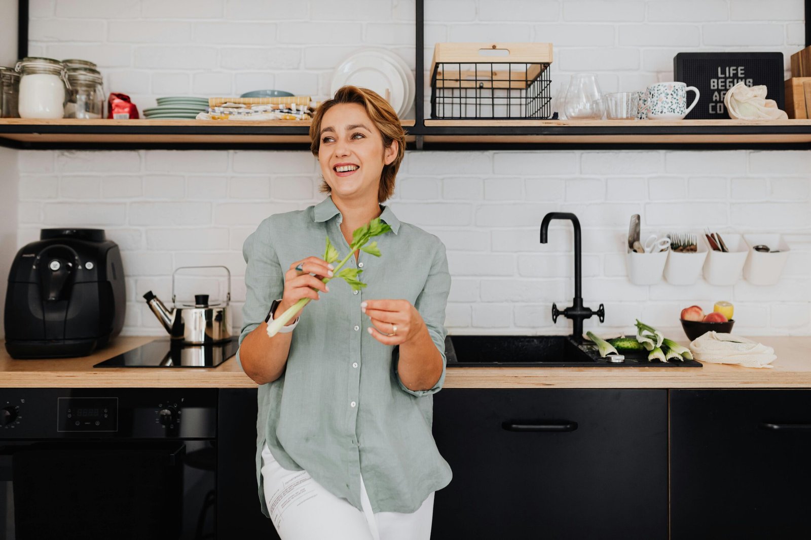 Smiling woman in kitchen