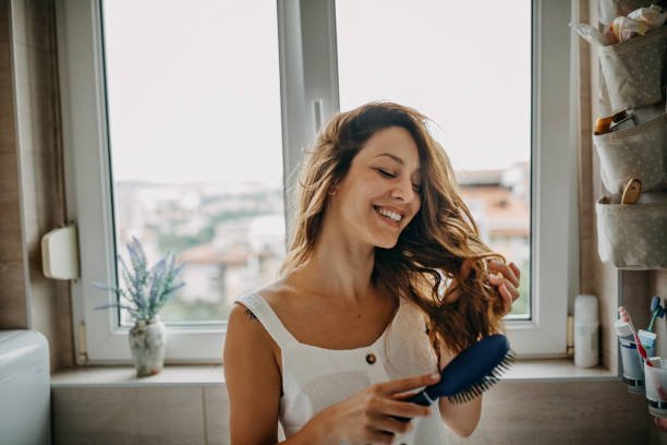 Woman styling hair