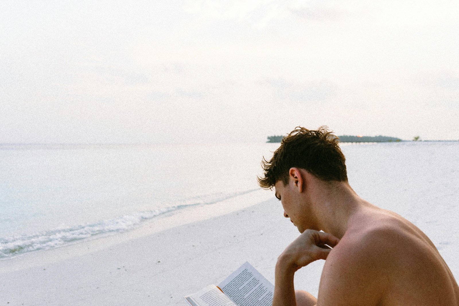 person reading on a beach